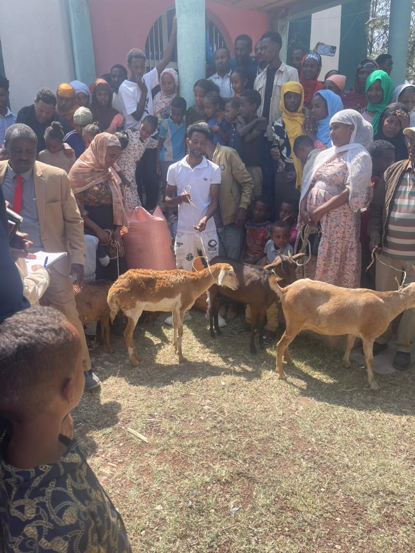 Community volunteers gathering to discuss project plans and coordinate efforts for the building campaign